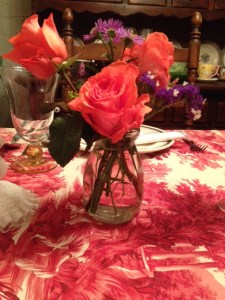 Coral roses to match the voile tablecloth